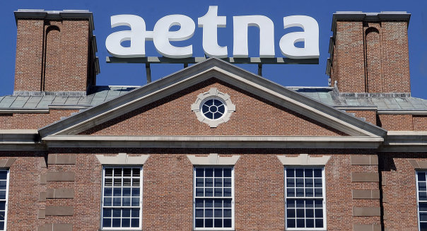 FILE  - In this Tuesday, Aug. 19, 2014, file photo, a sign for Aetna Inc., sits atop a building at the company headquarters in in Hartford, Conn. Health insurer Aetna Inc. has made a deal to buy competitor Humana Inc. in a  billion deal the companies say would create the second-largest managed care company, it was announced Friday, July 3, 2014. (AP Photo/Jessica Hill, File)