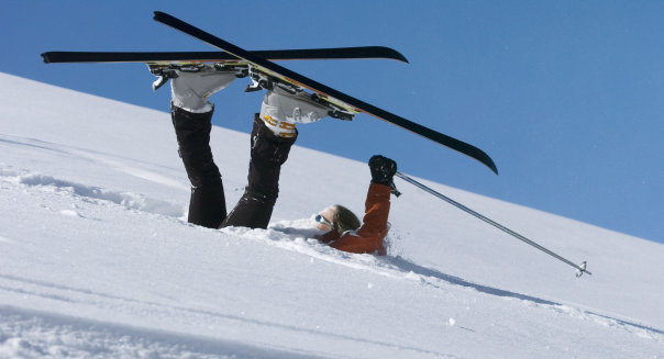 Fallen skier lying in powder snow